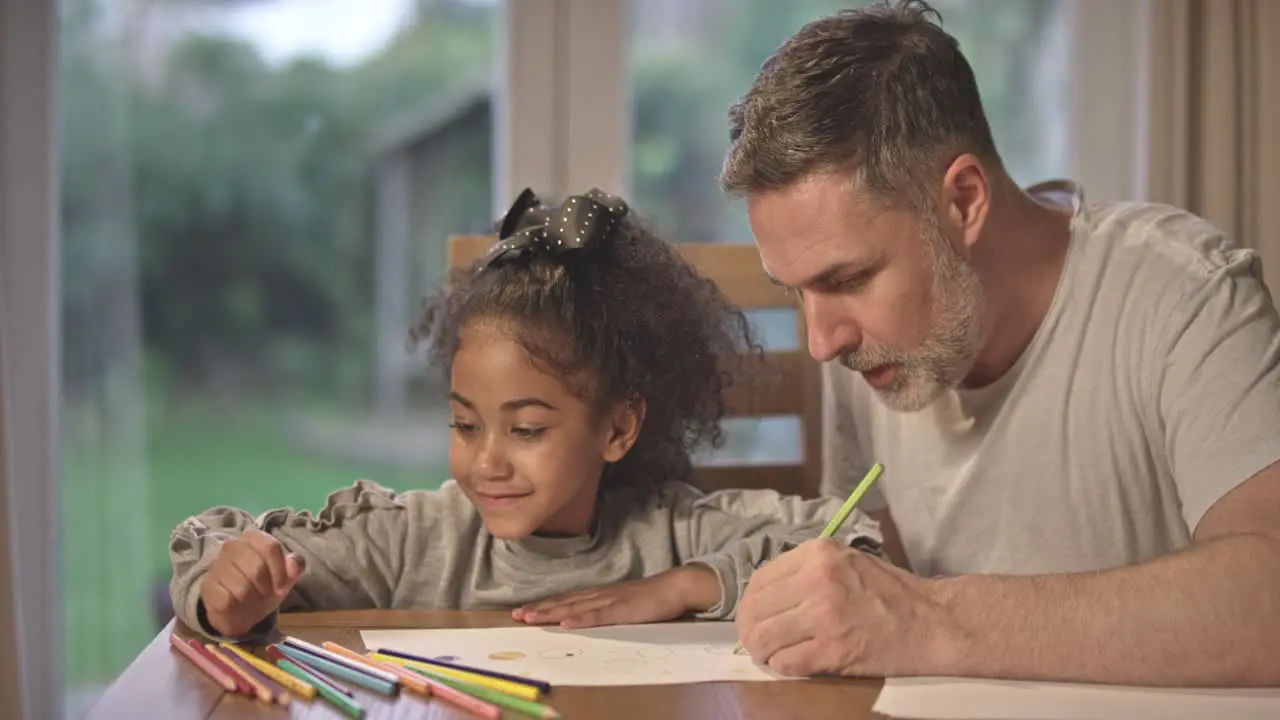 Dad and Daughter Drawing Together