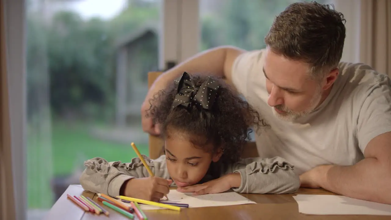 Father Watching Daughter Draw