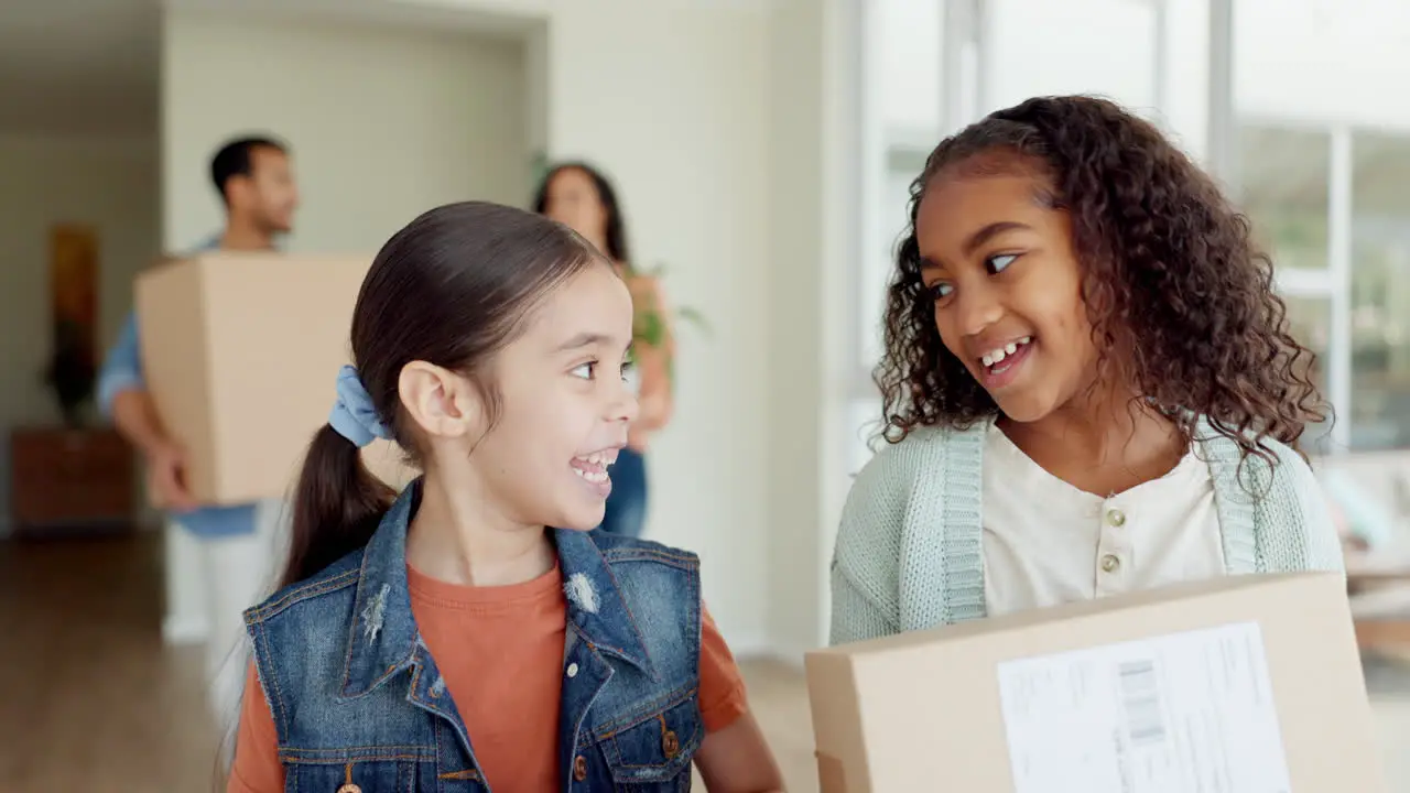 Happy family siblings and box moving in new home