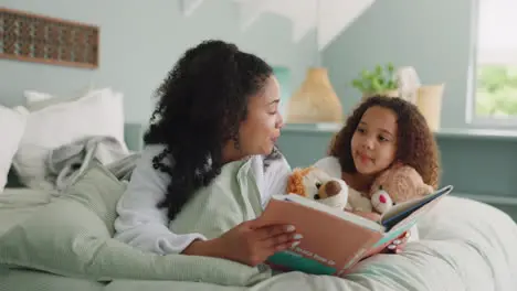 African mother child and reading book in bed