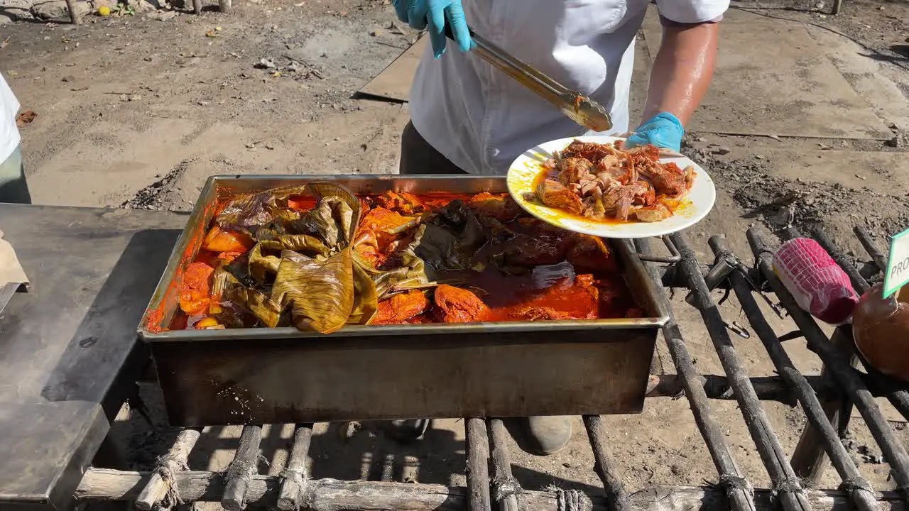 slow motion shot of cochinita pibil served in merida yucatan mexico