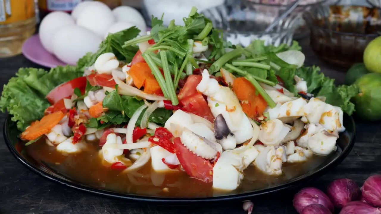 Close up of delicious Thai squid and vegetable dish on table