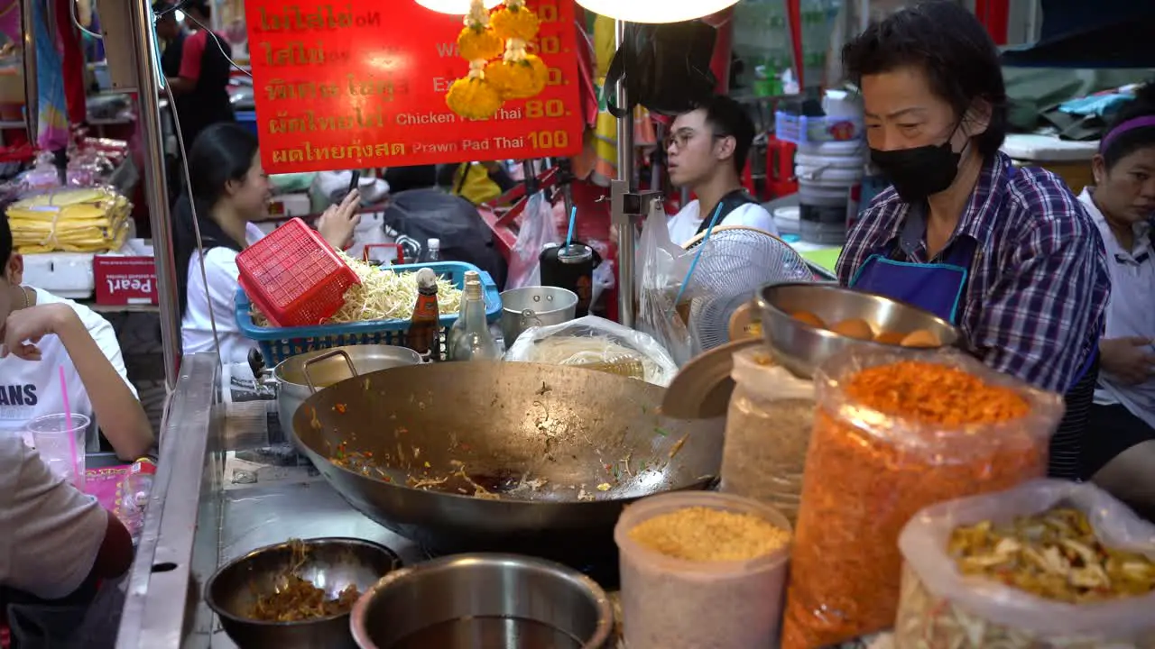 Scene of street food vendors stir-fried Pad Thai in the famous Yaowarat Chinatown Bangkok