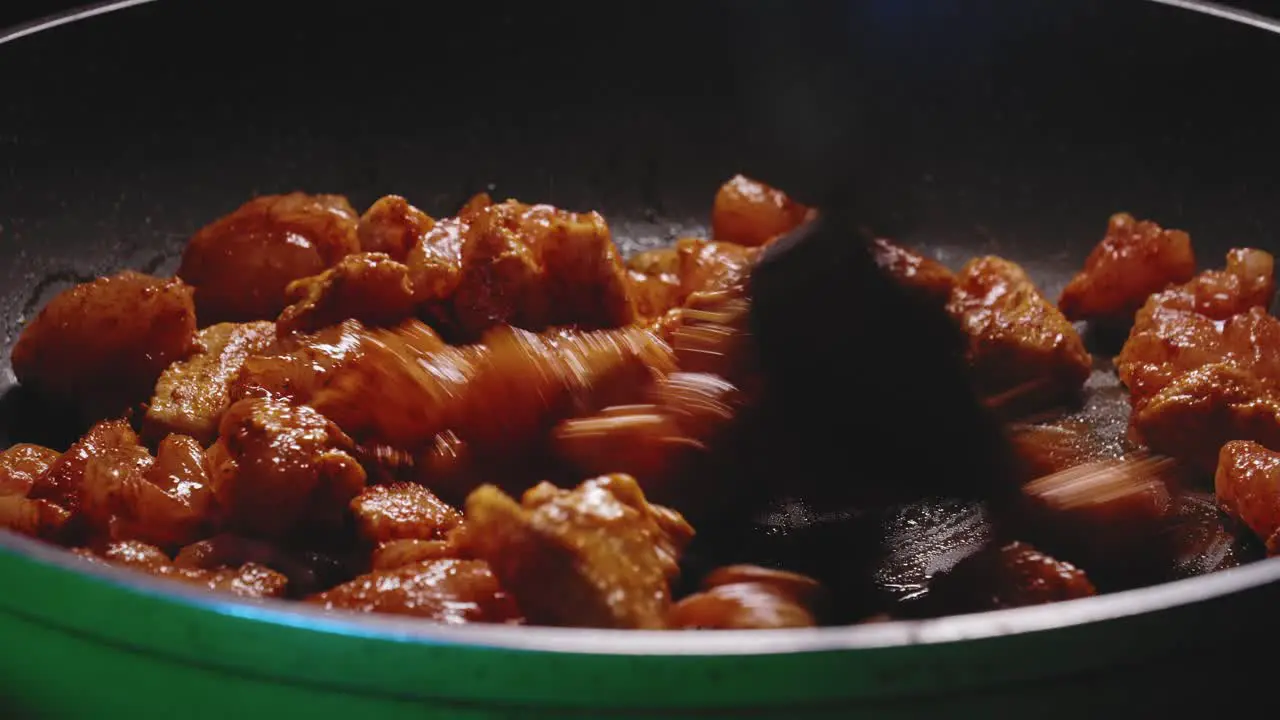 Person Stir in Pan Full Of Chicken Meat Cooking Dinner