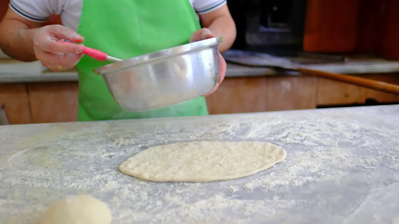 chef is preparing pita dough