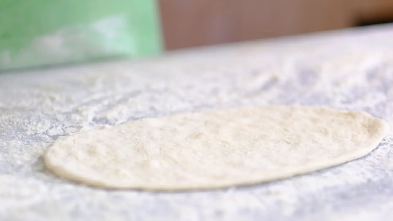 chef is preparing pita dough slow motion