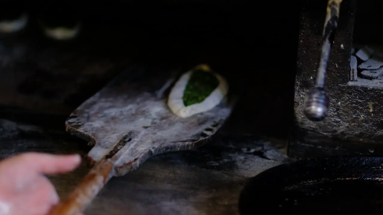 pita is placed in the oven to bake