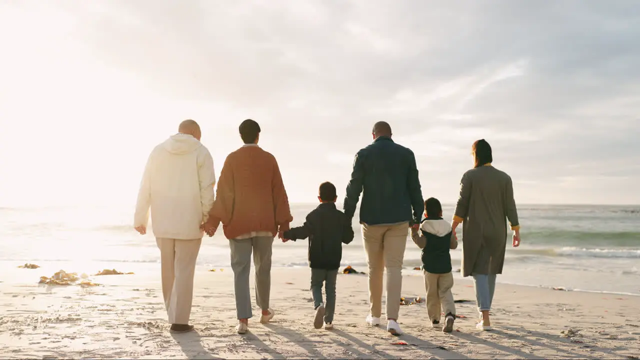 Beach sunset and big family holding hands