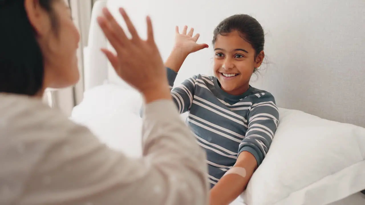 First aid high five and bandage with mother