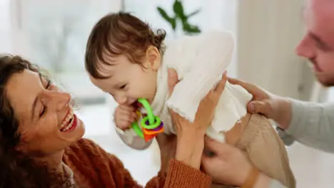 baby family and parents play airplane for child