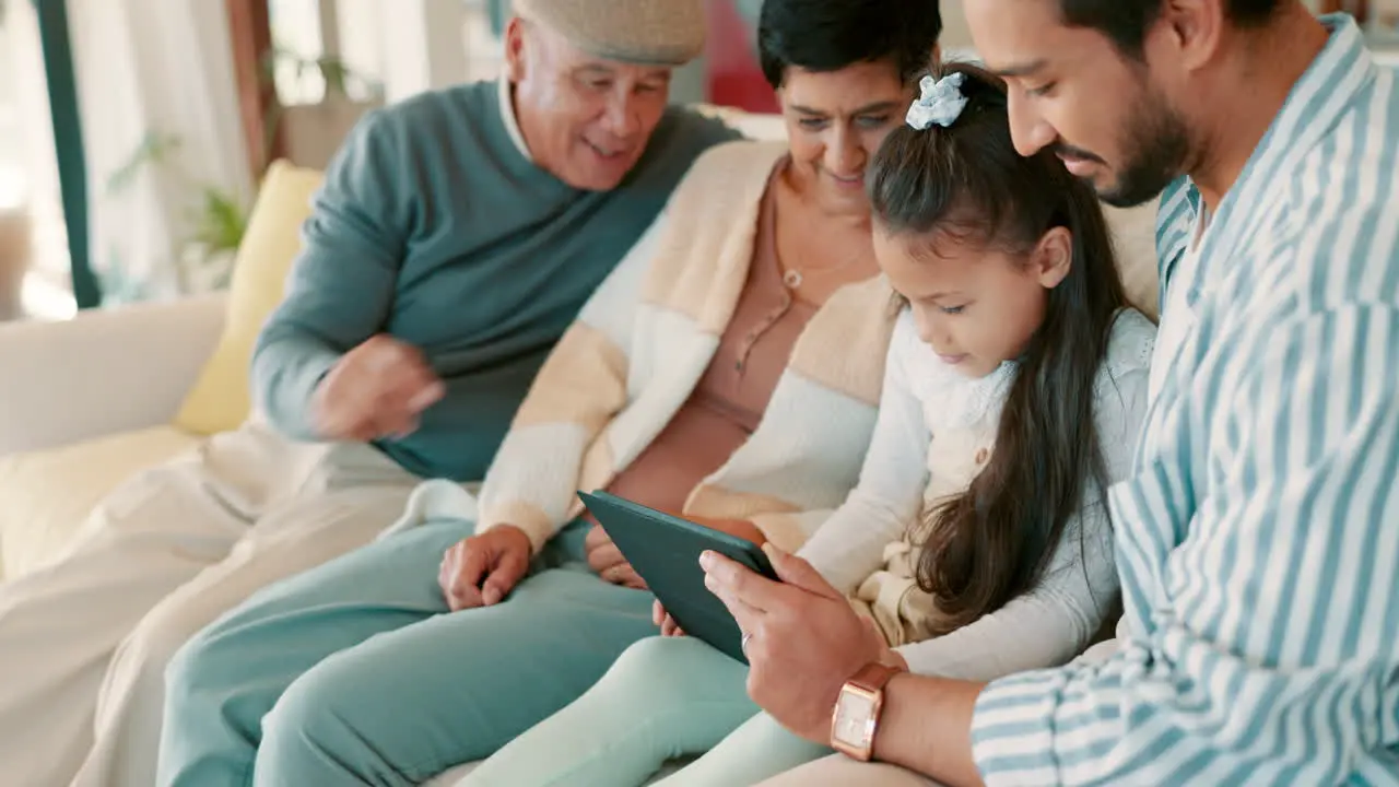 Relax tablet and happy with big family on sofa