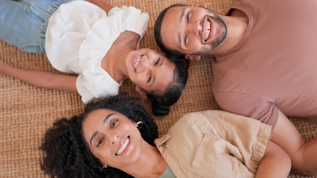 Happy family face and relax on a floor with love