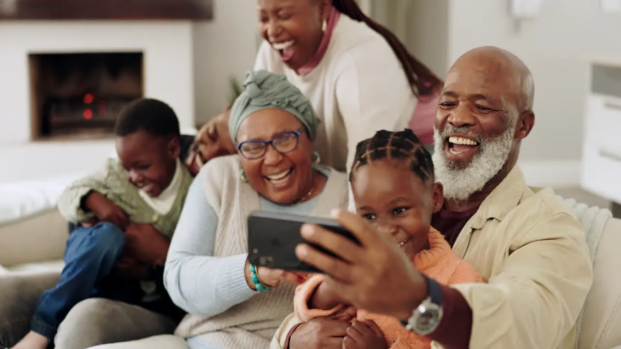 Black family home and happy laughing on sofa