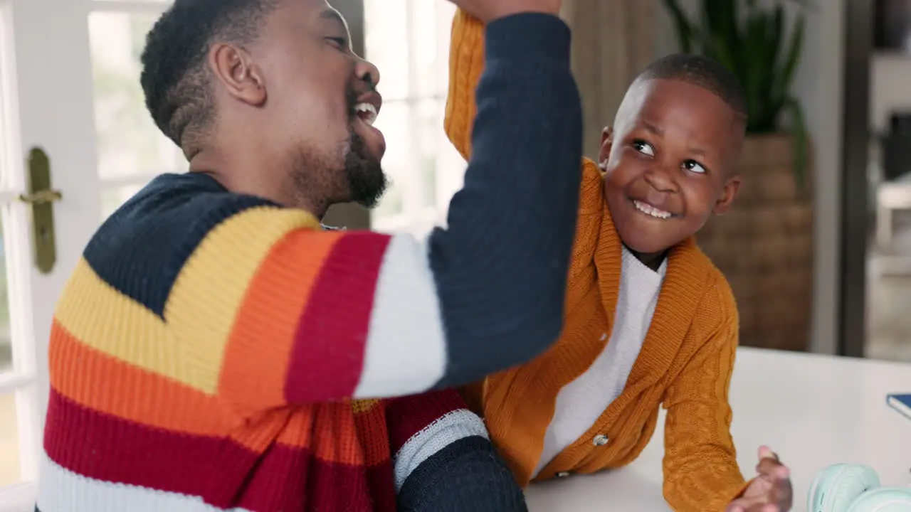 Black family high five and father with child