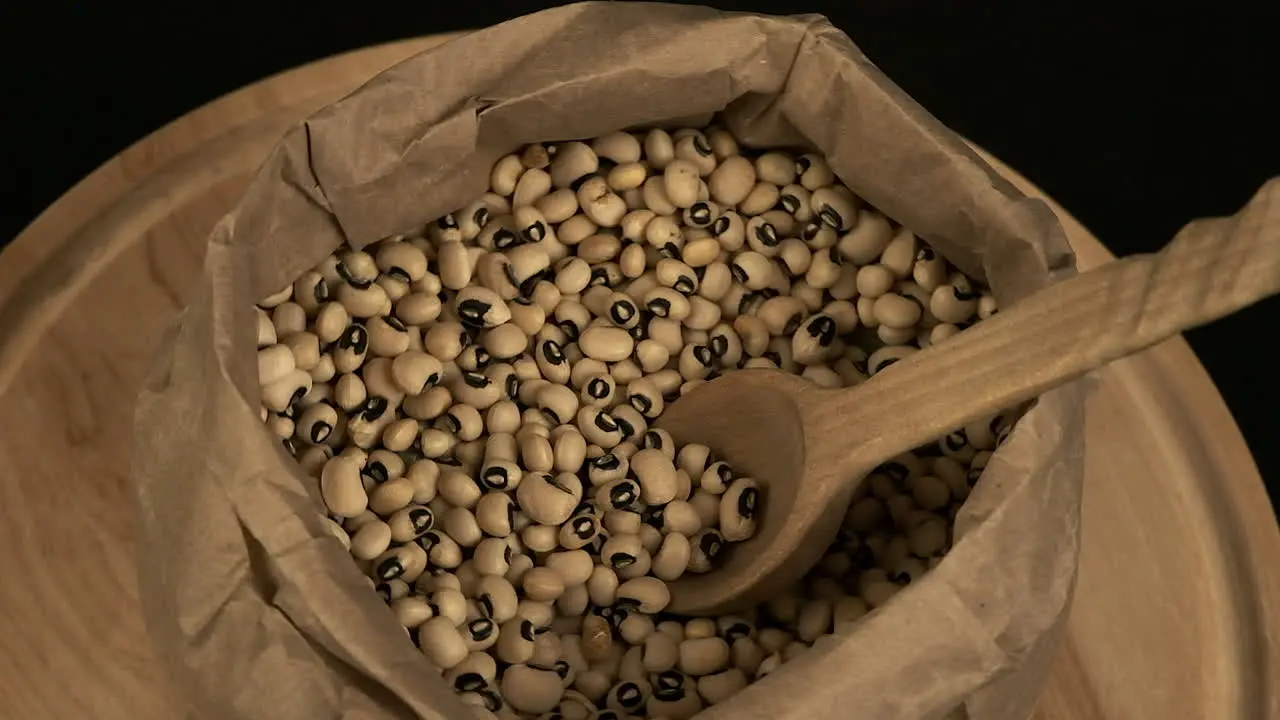 High angle view Nutritious dried black-eyed peas rotate in paper bag