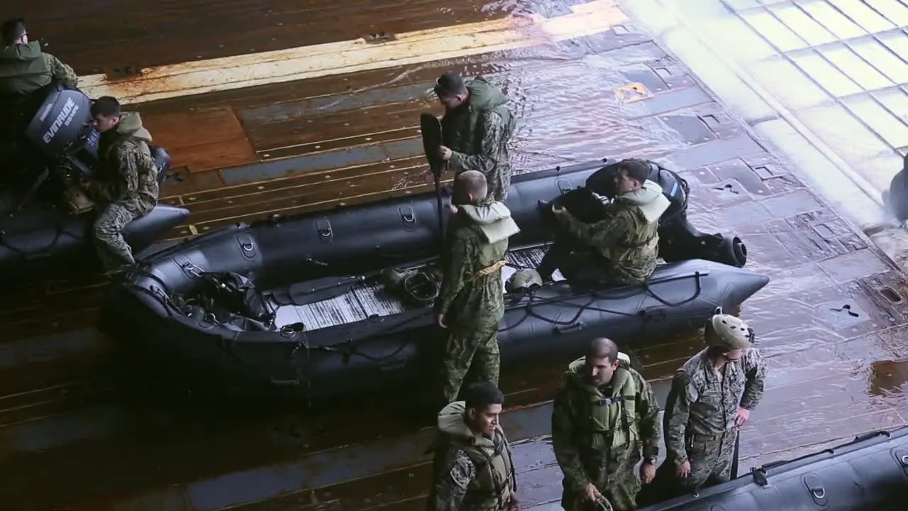 Us Marines Prepare For Launch And Recovery Drills With Rubber Raiding Craft From A Ship In the Philippine Sea