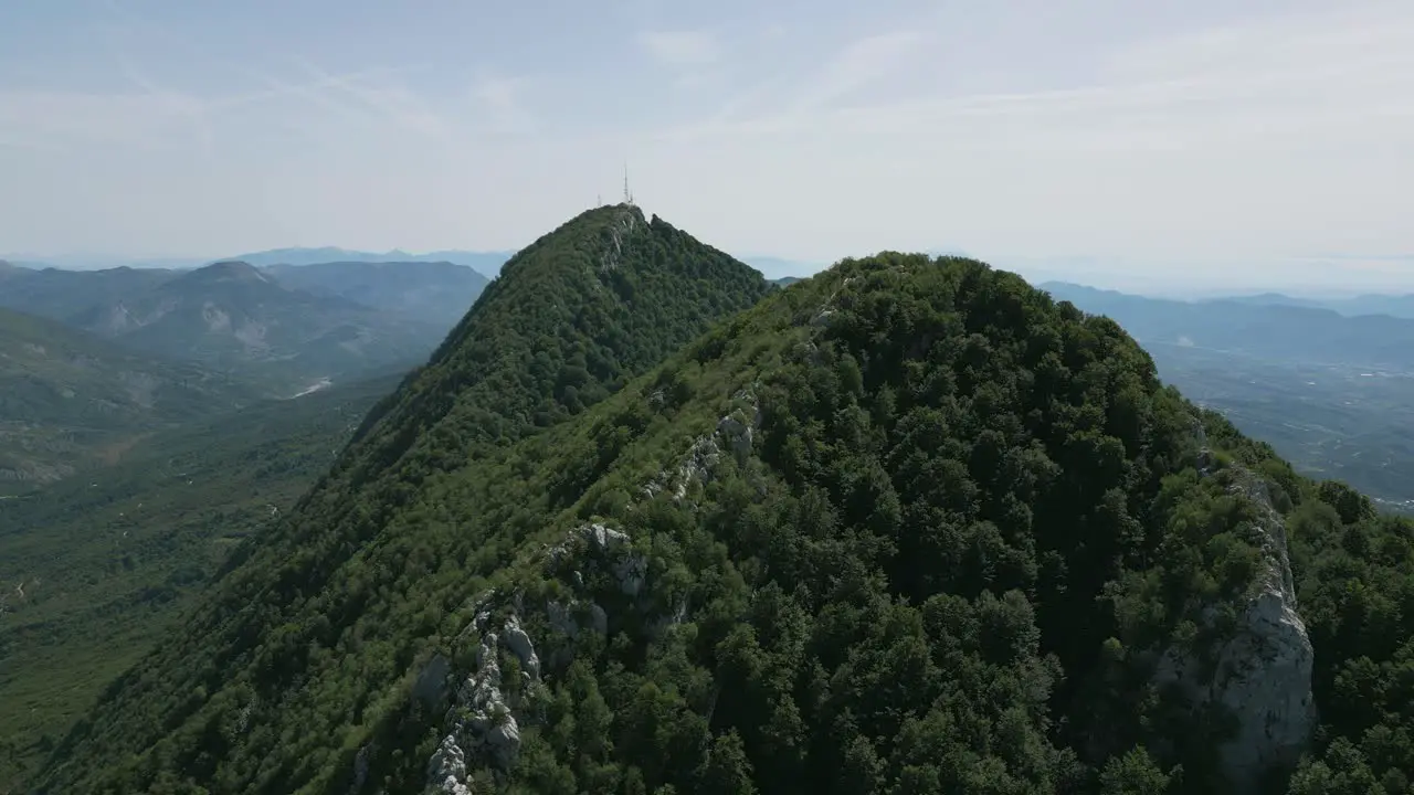 Aerial shot moving past Dajti mounatin in national park near Tirana Albania