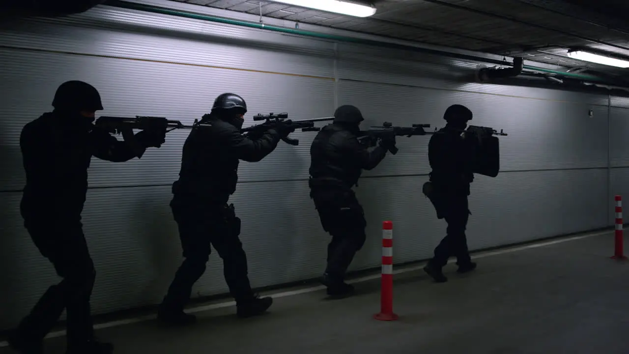 Soldiers storming building Special assault team aiming targets on firearms