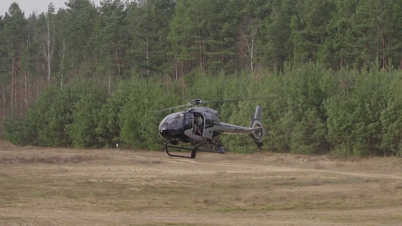 Military Helicopter Airbus Eurocopter EC 120 Landing on Field 50fps