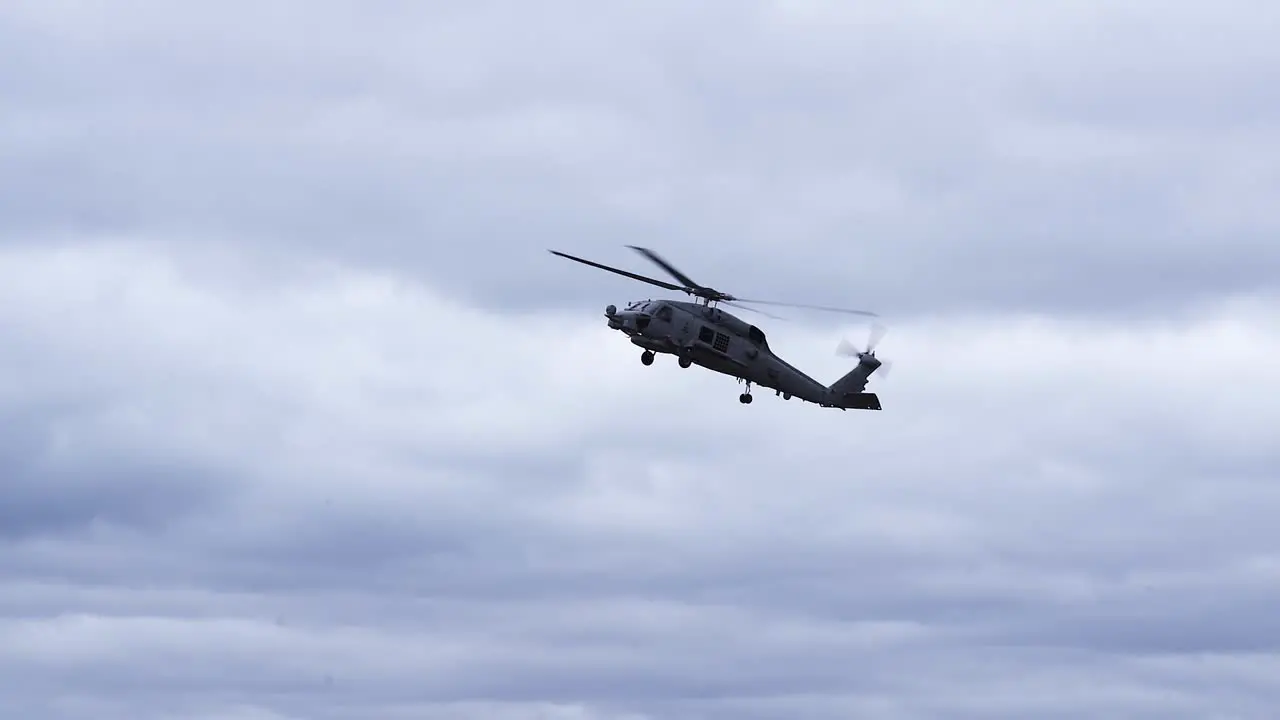 MH-60R Seahawk Maritime Helicopter On Flight Against Cloudy Sky