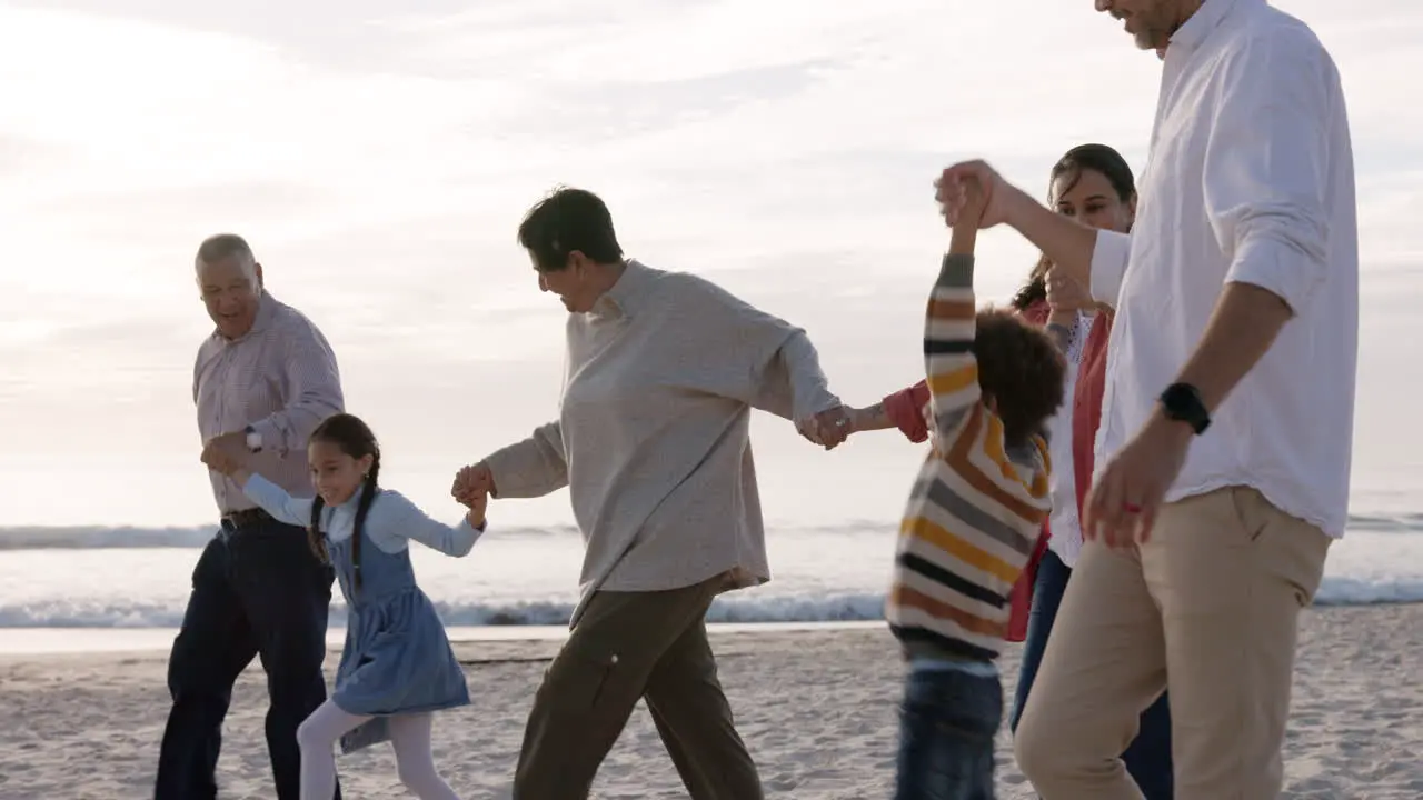 Beach children and happy family holding hands