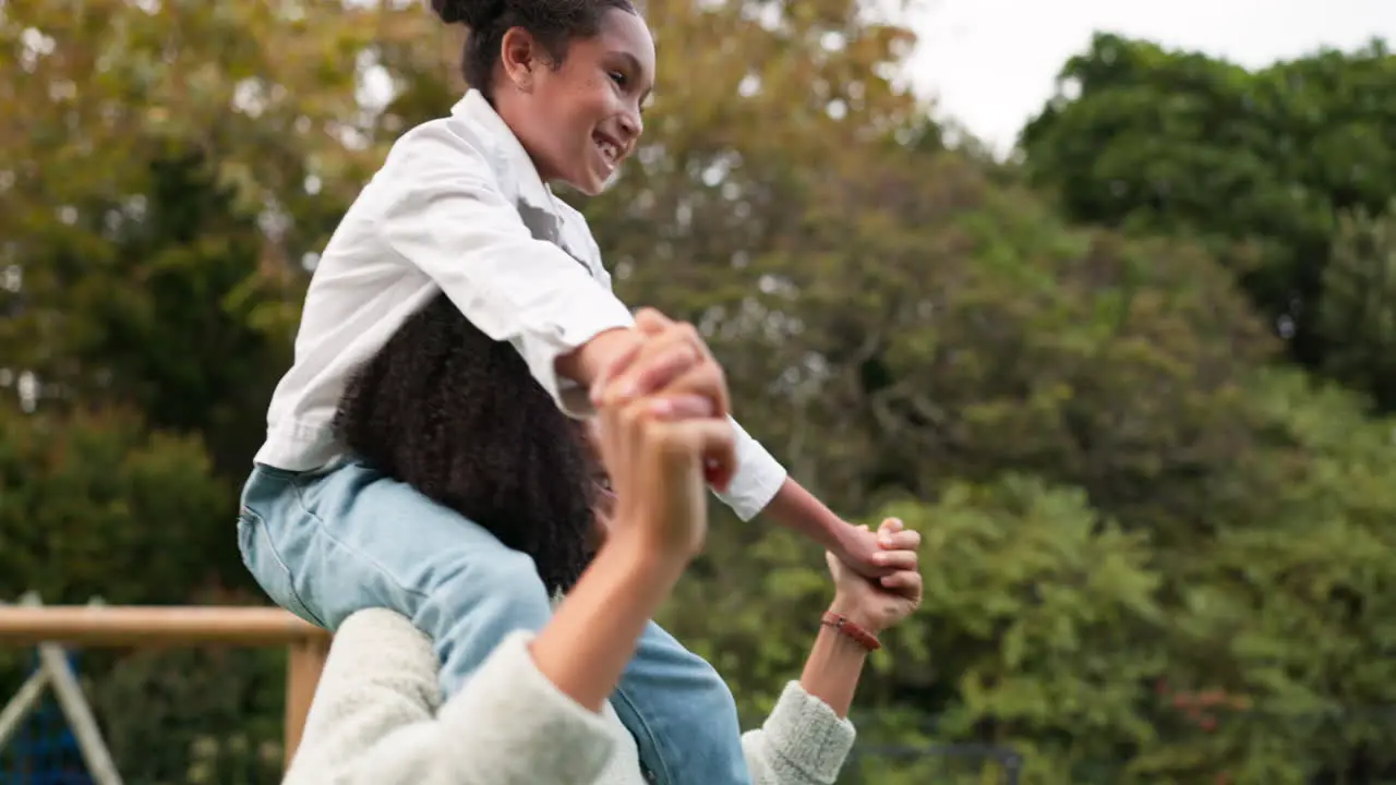 Mother daughter and piggyback walking in park