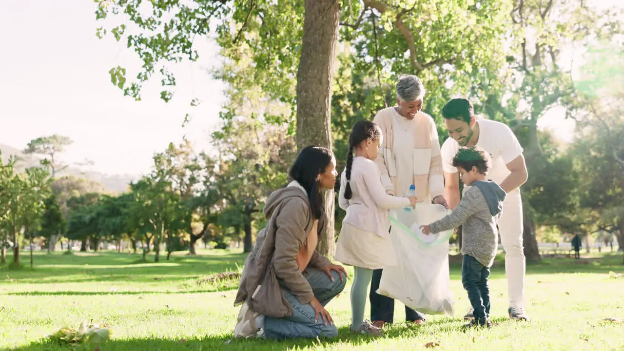 Happy family volunteer and cleaning park for eco