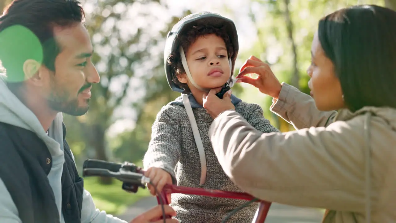 Helmet bicycle and parents with child in park