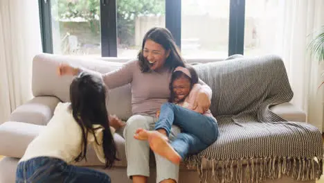 Happy family having fun on a sofa at home