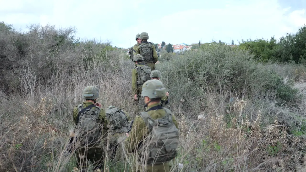 IDF Golani Brigade infantry soldiers moving on bushy terrain Golan heights Syria