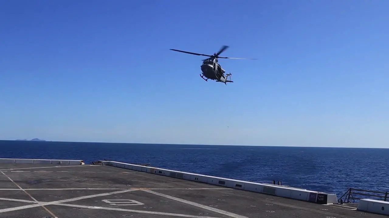 Us Marines Conduct A Fast Rope Drill From A Uh-Y1 Venom Helicopter Onto The Deck Of The Uss New Orleans