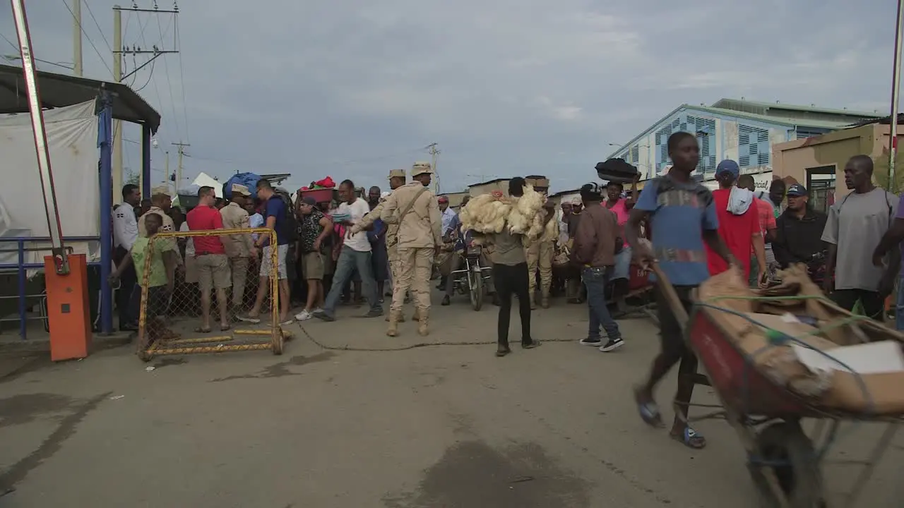 Crowds passing the border between Haiti and Dominican Repubblic