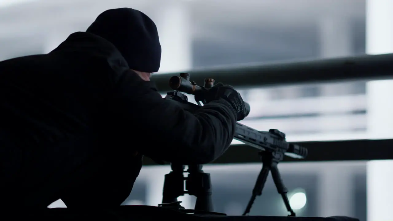 Killer adjusting sight on sniping rifle Sniper preparing weapon for shooting