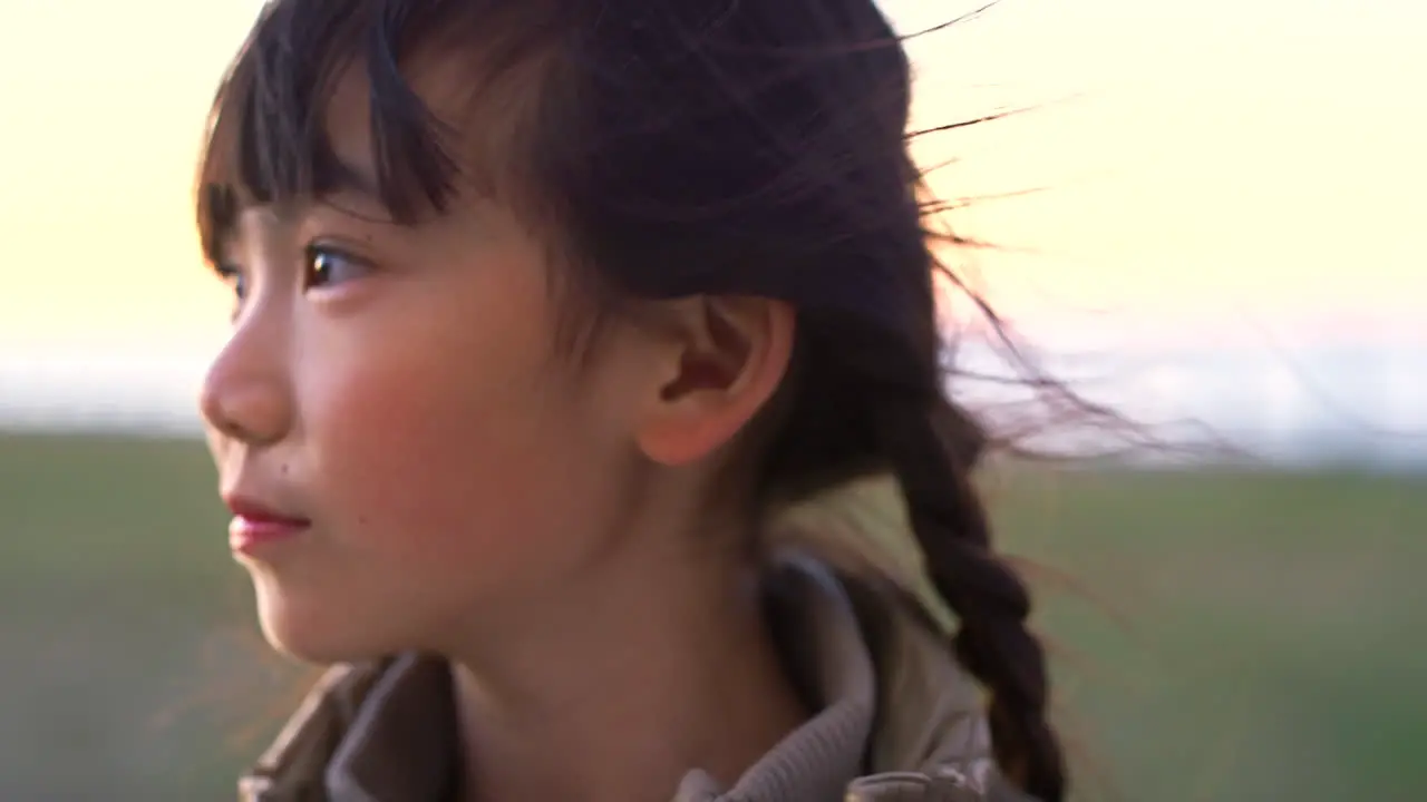 Girl face and smile happy in a field having fun