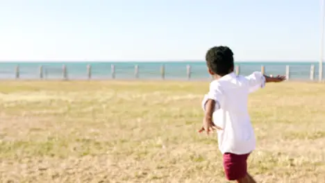 Fun boy and sea happiness of a child playing