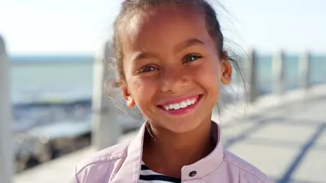 Child girl and face by beach