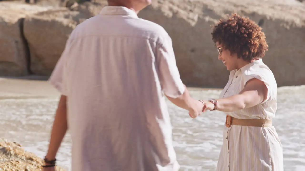 Holding hands love and couple on beach