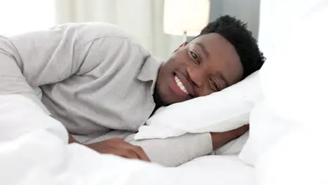 Sleep bed and man portrait in bedroom at a luxury