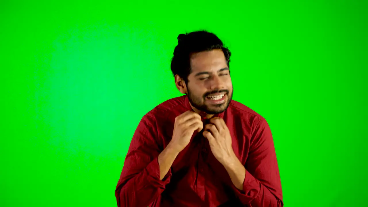 Indian guy standing during hot weather with green screen green chroma key