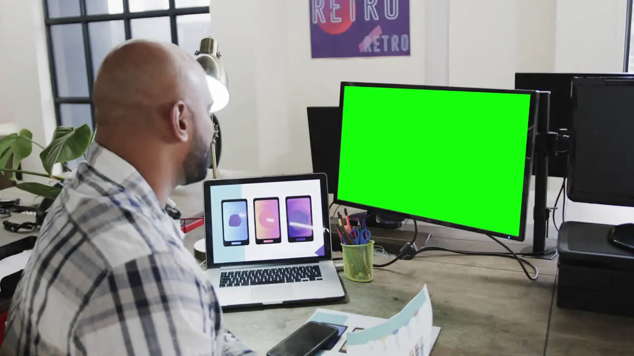 African american businessman on video call with green screen