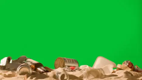 Pollution Concept With Bottles And Rubbish On Beach Against Green Screen 2