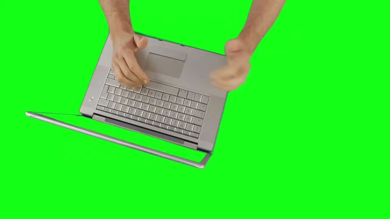 Overview of mans hands using a laptop