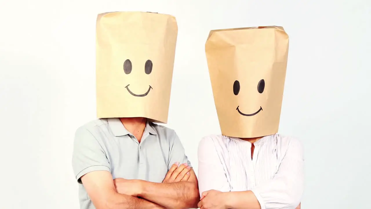 Couple with paper bags on the head