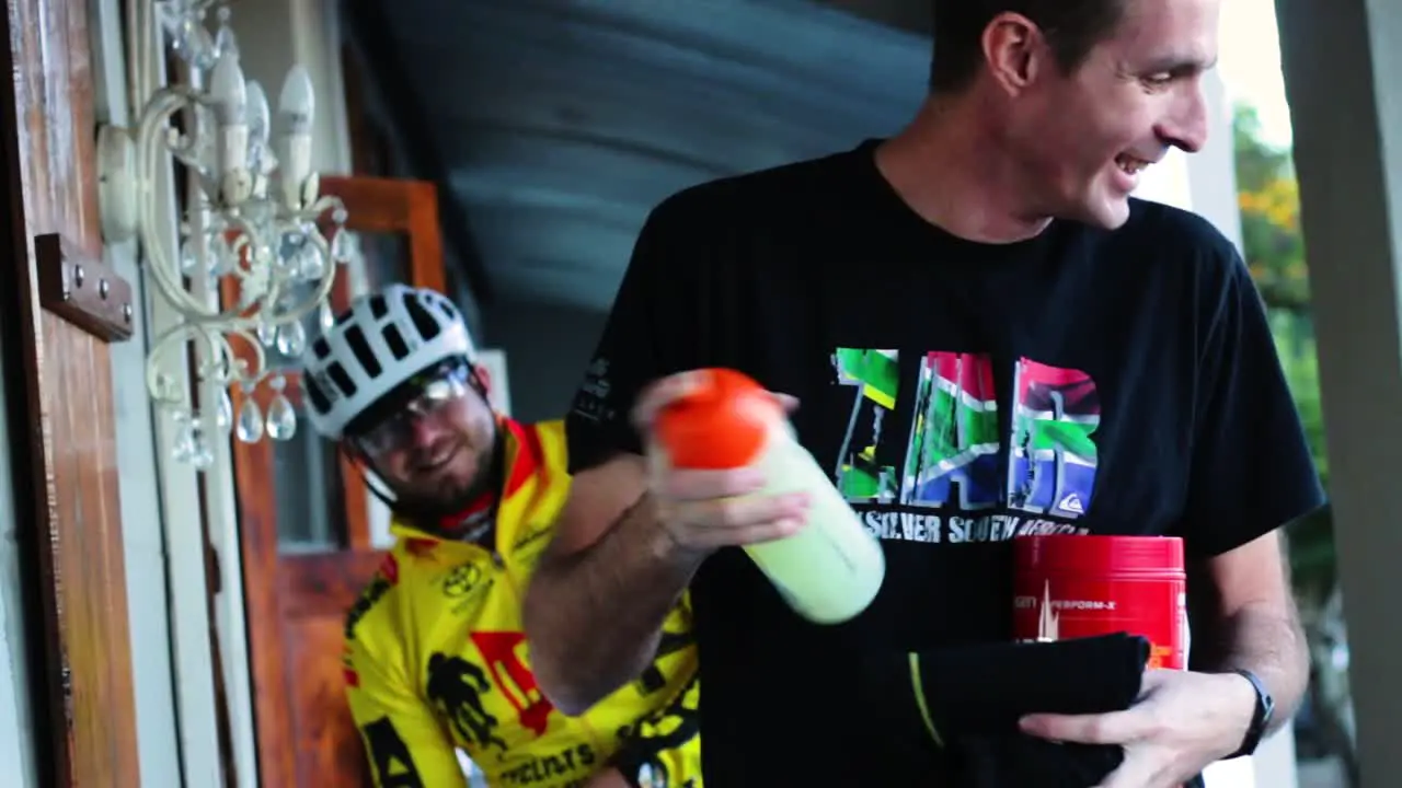 Cyclist getting energy drink ready for cycling