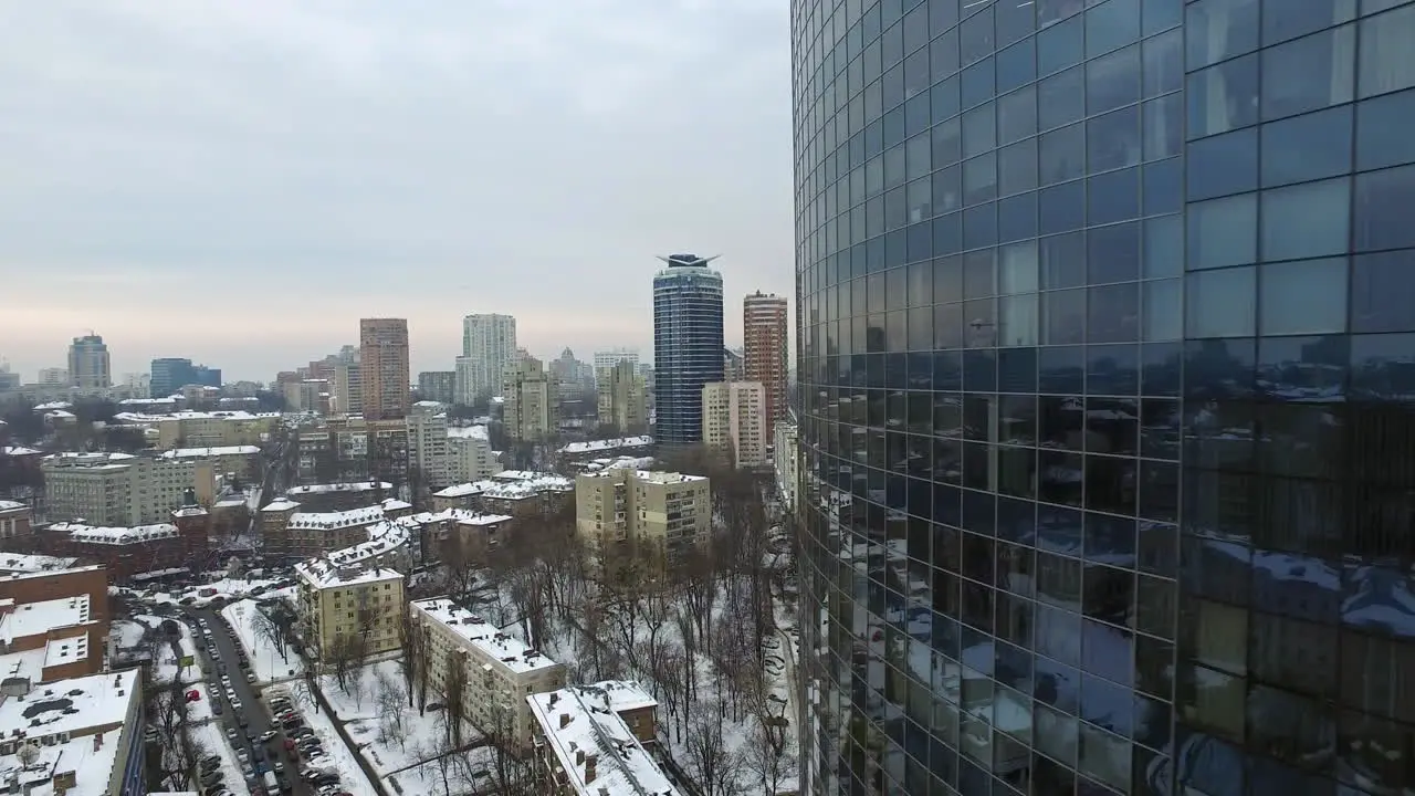 Glass skyscraper in city architecture at winter Aerial view business skyscraper