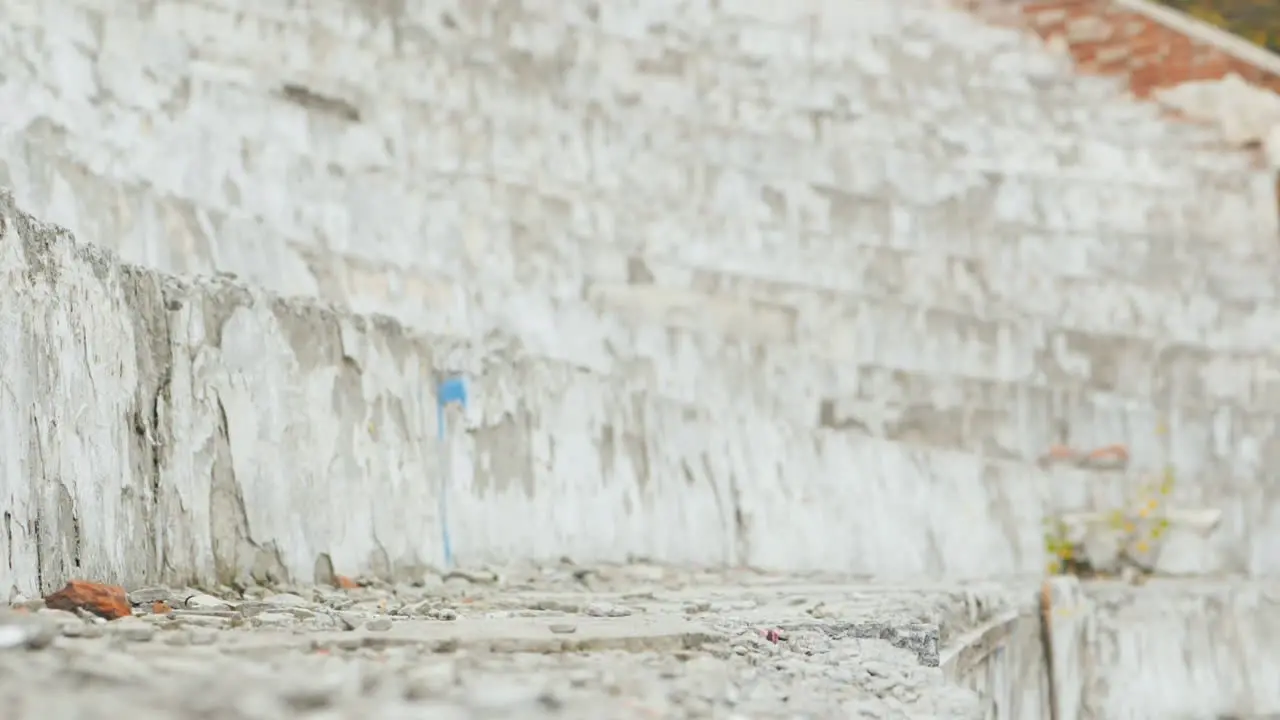 Racing Drone Maneuvers Dangerously Near A Concrete Wall