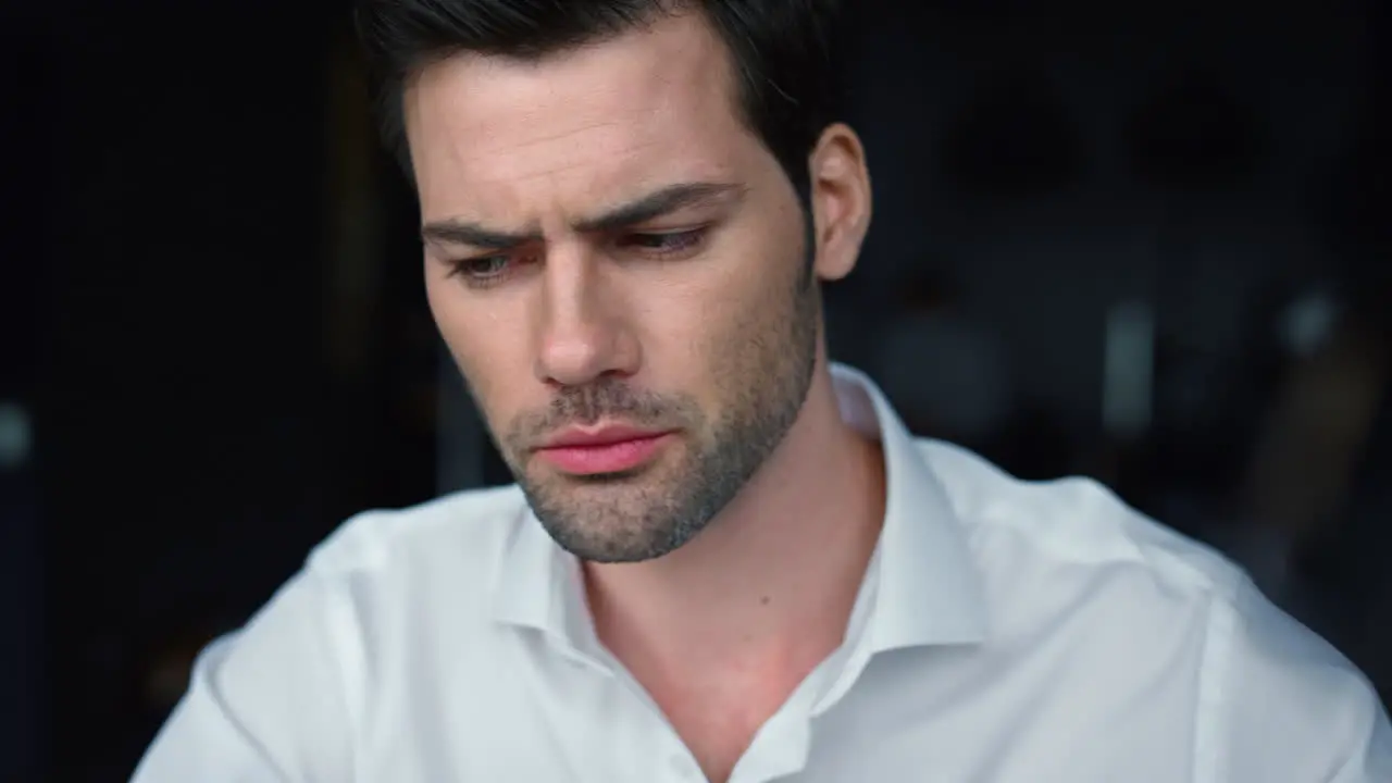 focused businessman looking down Male worker thinking about business project