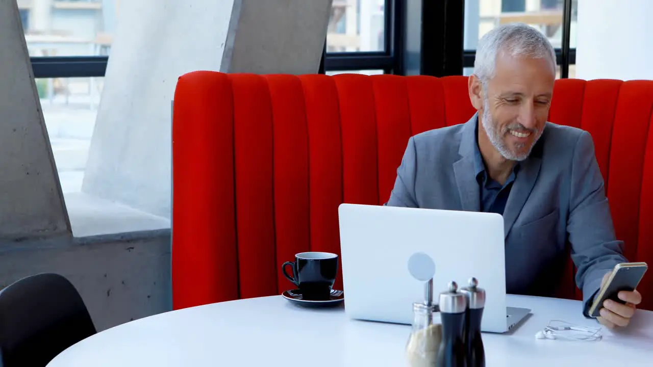 Businessman using mobile phone in hotel 4k