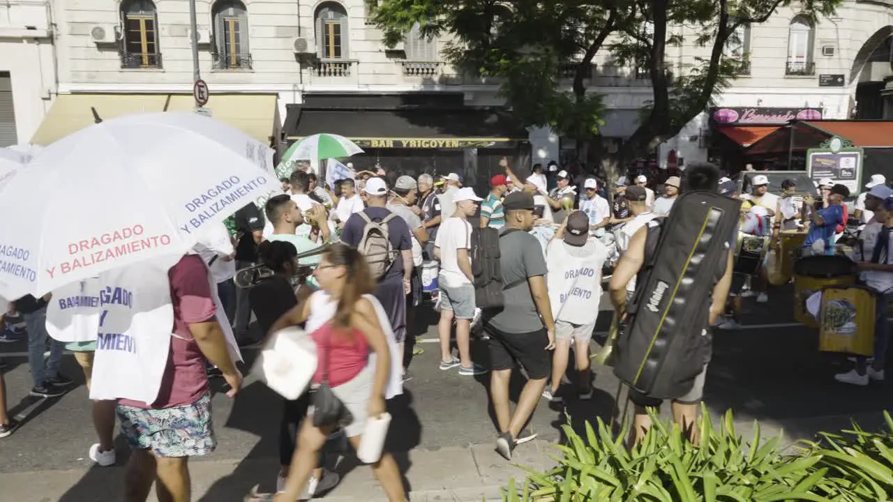 Protesters staying in a street and playing drums in Buenos Aires