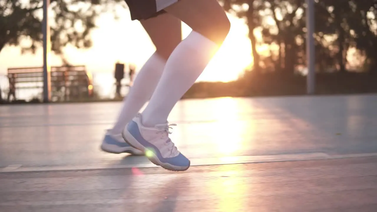 Close Up Shot Of Female Basketball Player Legs Doing Dribbling Exersice Very Quickly Without Ball Training Outdoors On The Local Court